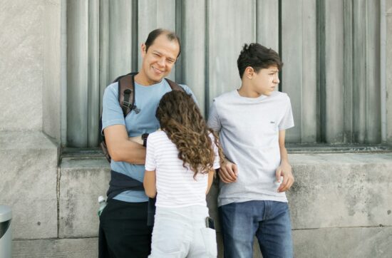 a man and woman with a child